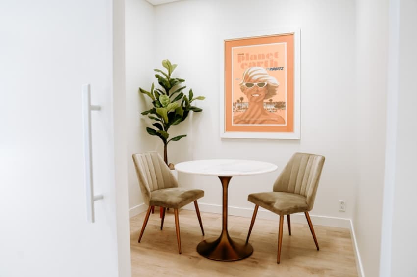 La Jolla Cosmetic Medical Spa waiting area with comfortable chairs and table